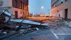 Debris from storm damage outside a commercial building.