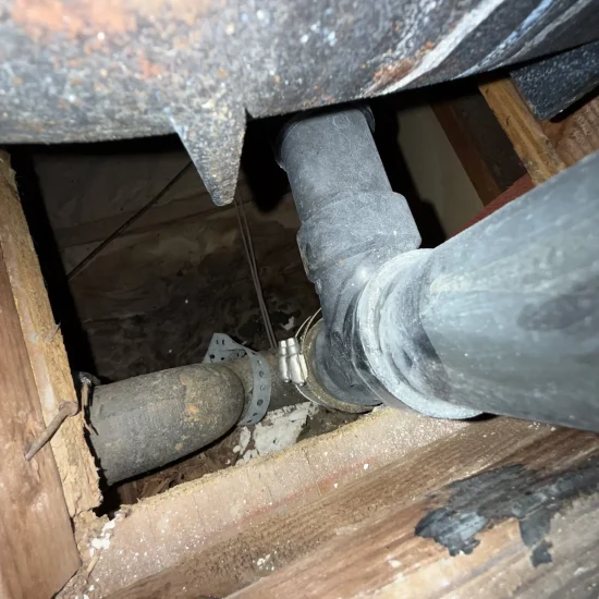 Ceiling cavity plumbing inspection revealing water damage source during professional assessment