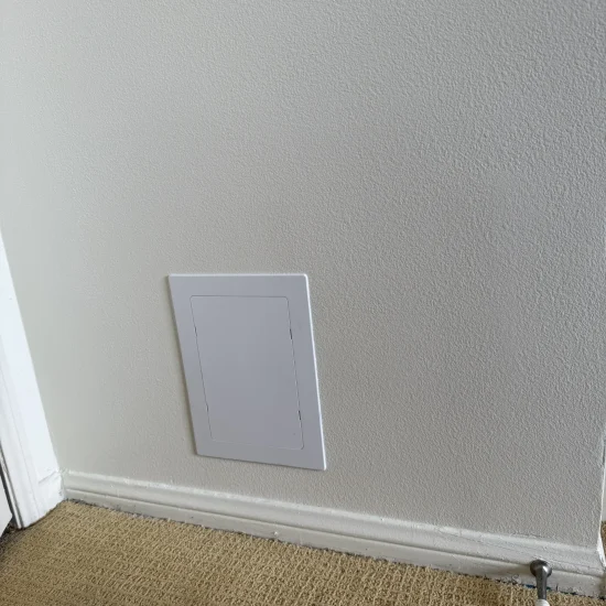 Hallway restoration completed with clean carpet and repainted walls after mold remediation