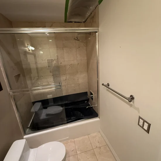 Active bathroom restoration progress in Marina Del Rey showing professional equipment and containment
